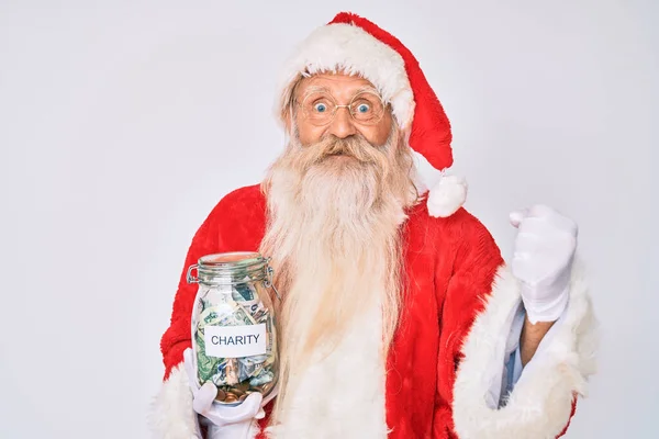 Old Senior Man Wearing Santa Claus Costume Holding Charity Jar — Stock Photo, Image