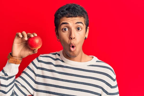 Young African Amercian Man Wearing Holding Heart Scared Amazed Open — Stock Photo, Image