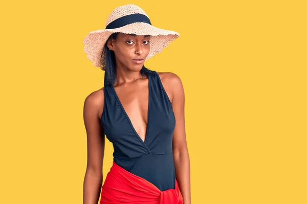 Young African American Woman Wearing Swimsuit Summer Hat Looking Sleepy — Stock fotografie