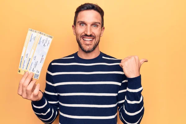 Young Handsome Tourist Man Vacation Holding Airline Boarding Pass Yellow — Stock Photo, Image