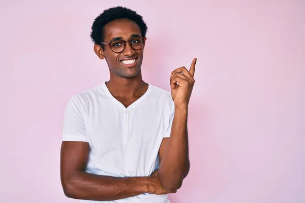 African Handsome Man Wearing Casual Clothes Glasses Smiling Happy Pointing — Stock Photo, Image