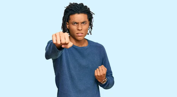 Young African American Man Wearing Casual Winter Sweater Punching Fist — Stock Photo, Image