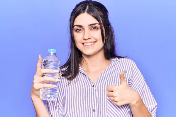 Young Beautiful Girl Holding Bottle Water Smiling Happy Positive Thumb — Stock Photo, Image