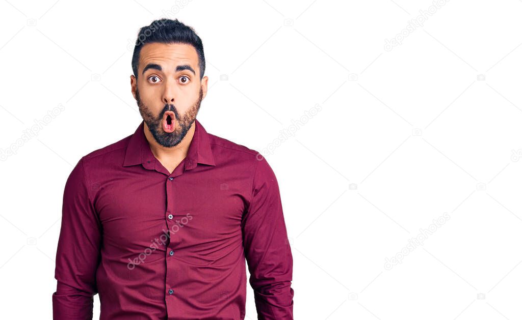 Young hispanic man wearing casual clothes scared and amazed with open mouth for surprise, disbelief face 