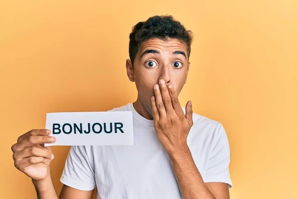 Joven Hombre Afroamericano Guapo Sosteniendo Bonjour Palabra Saludo Francés Que —  Fotos de Stock