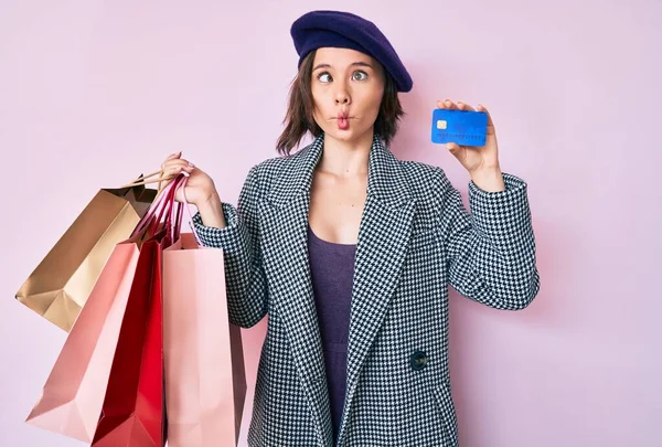 Young Beautiful Woman Wearing Beret Holding Shopping Bags Credit Card — Stockfoto