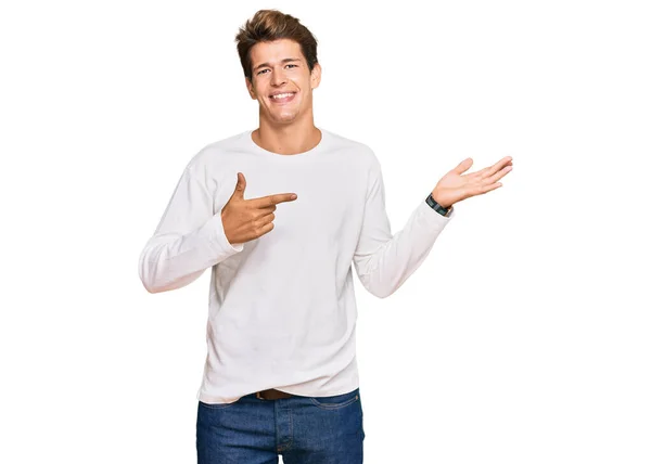 Handsome Caucasian Man Wearing Casual White Sweater Amazed Smiling Camera — Stock Photo, Image