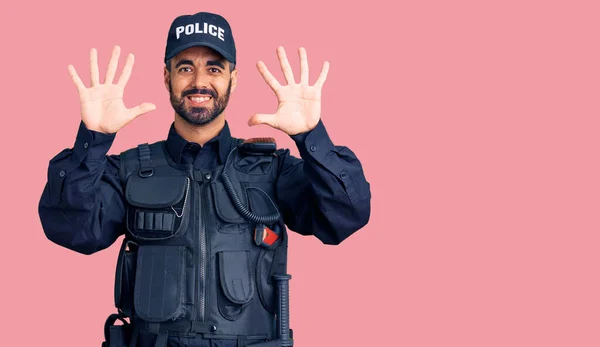 Young Hispanic Man Wearing Police Uniform Showing Pointing Fingers Number — Stock Photo, Image