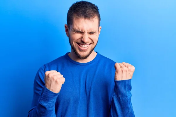 Young Handsome Man Wearing Casual Sweater Celebrating Surprised Amazed Success — Stock Photo, Image