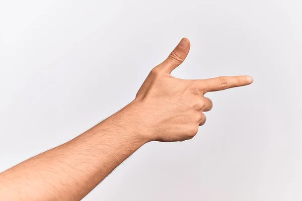 用食指指向侧边的孤立的白色背景上伸出手指的高加索年轻人的手 建议并选择一种选择 — 图库照片