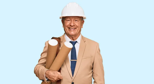 Senior Caucasian Man Wearing Safety Helmet Holding Blueprints Looking Positive — Stock Photo, Image