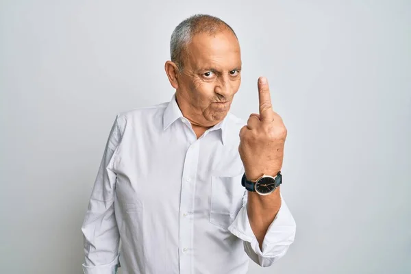 Handsome Senior Man Wearing Casual White Shirt Showing Middle Finger — Zdjęcie stockowe