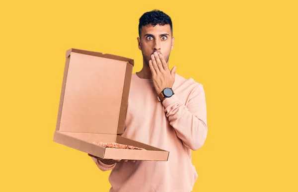 Young Hispanic Man Holding Delivery Pizza Box Covering Mouth Hand — Stock Photo, Image