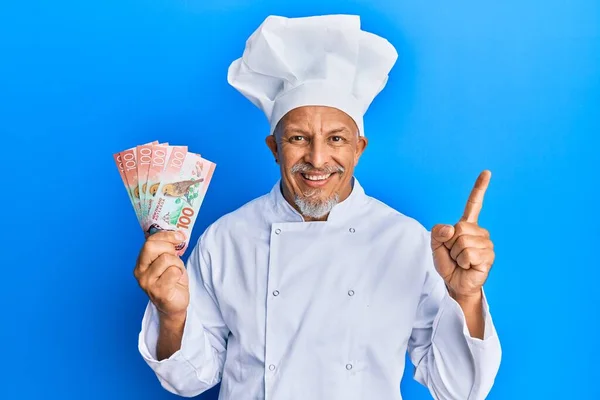 Middle Age Grey Haired Man Wearing Professional Cook Uniform Holding — Stock Photo, Image