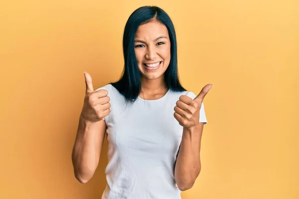 Beautiful Hispanic Woman Wearing Casual White Tshirt Success Sign Doing — Foto Stock