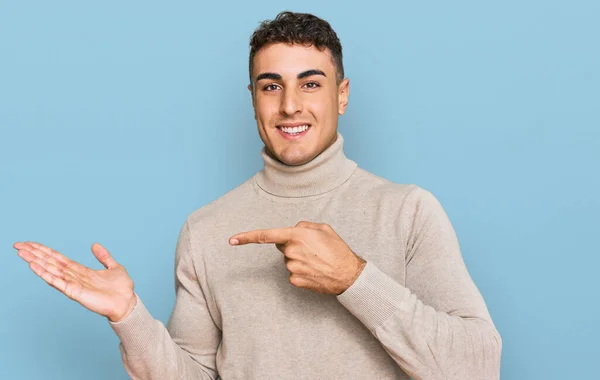 Hispanic Young Man Wearing Casual Turtleneck Sweater Amazed Smiling Camera — Stock Photo, Image