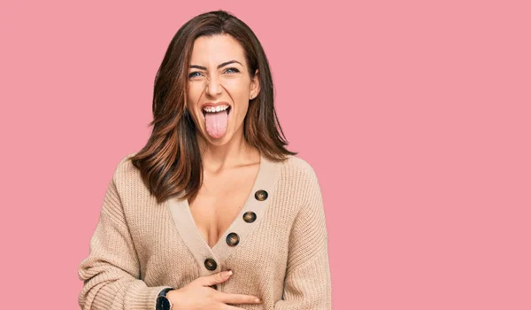 Mujer Morena Joven Vistiendo Suéter Invierno Casual Sacando Lengua Feliz —  Fotos de Stock