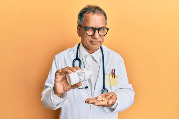 Middle Age Indian Man Wearing Doctor Uniform Holding Prescription Pills — Stock Photo, Image