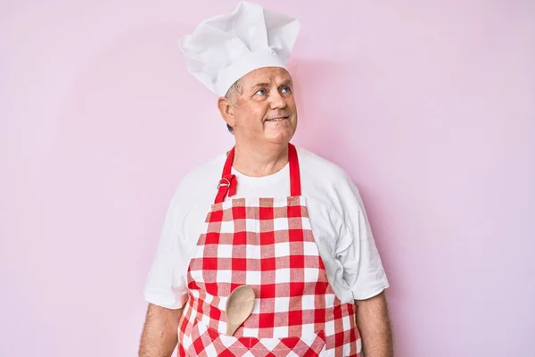 Senior Grey Haired Man Wearing Professional Baker Apron Looking Away — Stock Photo, Image