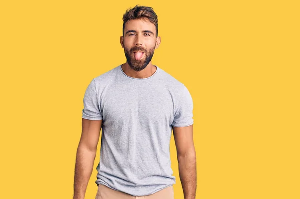 Young Hispanic Man Wearing Casual Clothes Sticking Tongue Out Happy — Stock Photo, Image