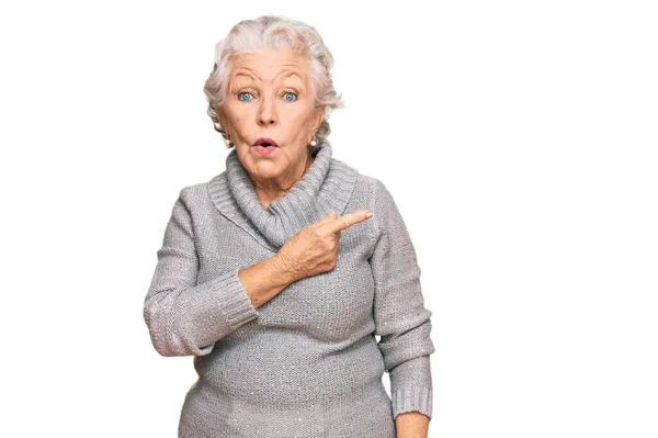 Senior Grey Haired Woman Wearing Casual Winter Sweater Surprised Pointing — Stock Photo, Image