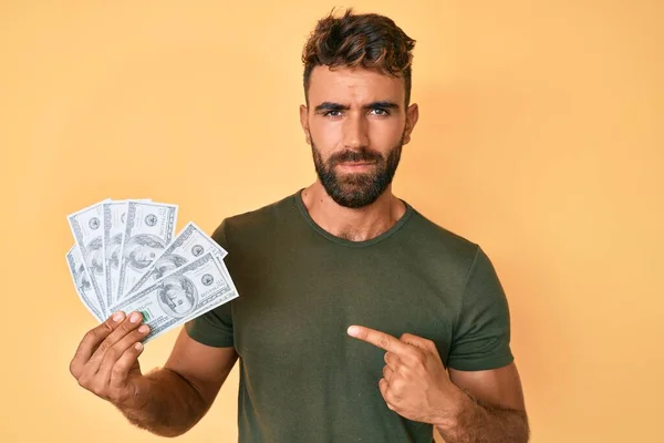 Young Hispanic Man Holding Dollars Relaxed Serious Expression Face Simple — Stock Photo, Image