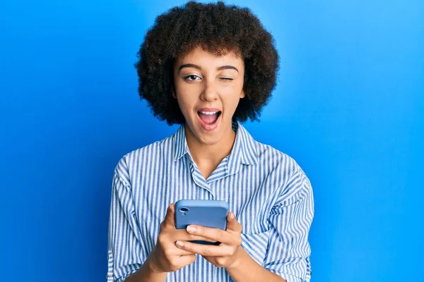 Young Hispanic Girl Using Smartphone Winking Looking Camera Sexy Expression — Stock Photo, Image