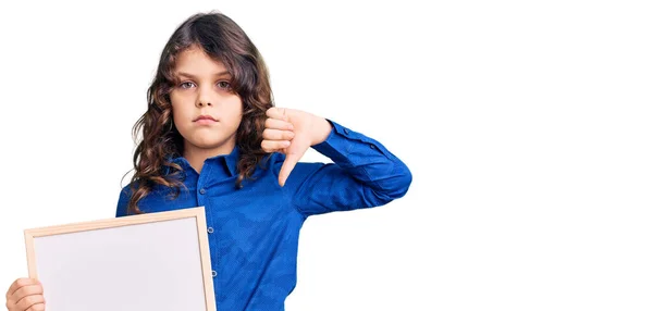 Cute Hispanic Child Long Hair Holding Empty White Chalkboard Angry — Stock Photo, Image