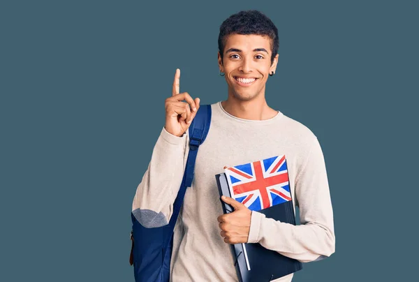 Young African Amercian Man Wearing Student Backpack Holding Binder Flag — Stock Photo, Image