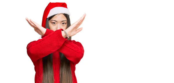 Young Chinese Woman Wearing Christmas Hat Rejection Expression Crossing Arms — Stock Photo, Image