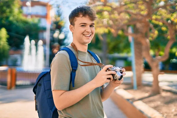 Young Caucasian Tourist Man Smiling Happy Using Vintage Camera City — Stock Photo, Image