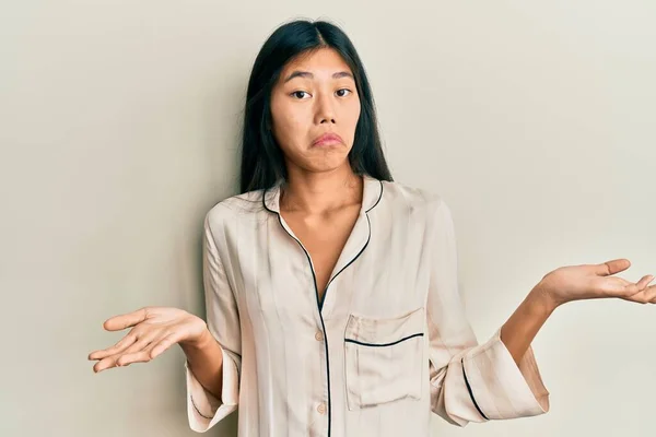Young Chinese Woman Wearing Pajama Clueless Confused Expression Arms Hands — Stock Photo, Image