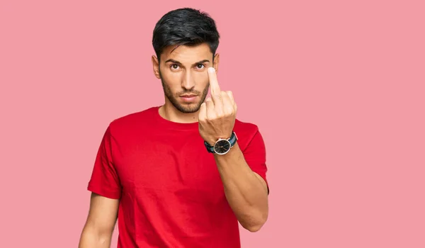 Young Handsome Man Wearing Casual Red Tshirt Showing Middle Finger — Stockfoto