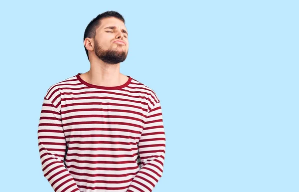 Young Handsome Man Wearing Striped Sweater Looking Camera Blowing Kiss — Stock Photo, Image