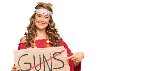 Young Blonde Girl Wearing Hippie Style Holding Guns Warning Banner — Stock Photo, Image