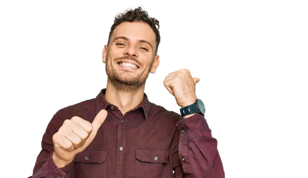 Young Hispanic Man Wearing Casual Clothes Pointing Back Hand Thumbs — Stock Photo, Image