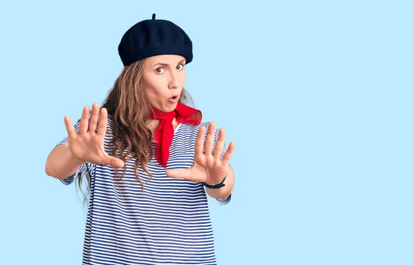 Young Beautiful Blonde Woman Wearing French Beret Striped Shirt Moving — Stock Photo, Image