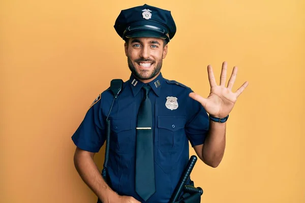 Snygg Hispanic Man Klädd Polis Uniform Visar Och Pekar Upp — Stockfoto