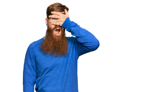 Young Irish Redhead Man Wearing Casual Clothes Peeking Shock Covering — Stock Photo, Image