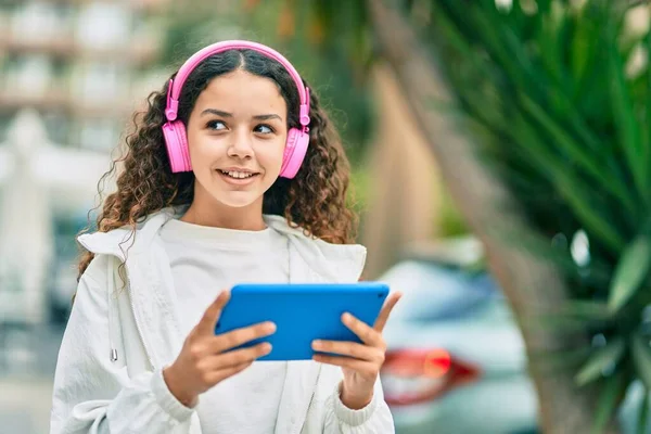 Hispanic Child Girl Smiling Happy Using Headphones Touchpad City — Stock Photo, Image