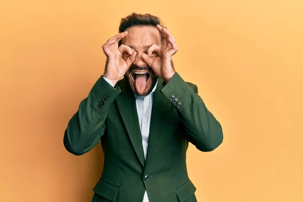 Middle Age Man Wearing Business Suit Doing Gesture Binoculars Sticking — Stock Photo, Image