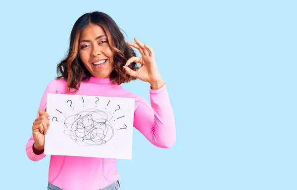 Young Beautiful Mixed Race Woman Holding Scribble Draw Doing Sign — Stock Photo, Image