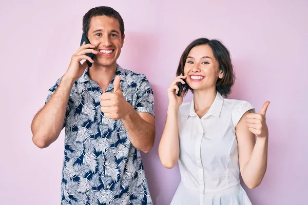 Beautiful Couple Having Conversation Talking Smartphone Smiling Happy Positive Thumb — Stock Photo, Image