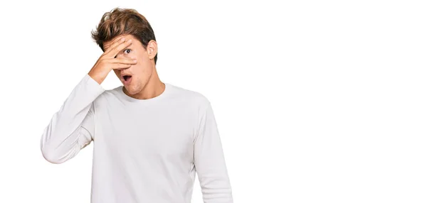 Handsome Caucasian Man Wearing Casual White Sweater Peeking Shock Covering — Stock Photo, Image