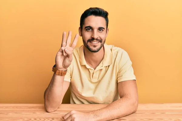 Young Hispanic Man Wearing Casual Clothes Sitting Table Showing Pointing — Stock Photo, Image