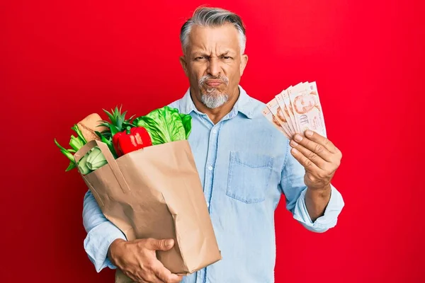 Middle Age Grey Haired Man Holding Groceries Singapore Dollars Banknotes — Stock Photo, Image