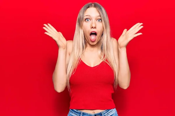 Young Blonde Woman Wearing Casual Clothes Celebrating Crazy Amazed Success — Stock Photo, Image