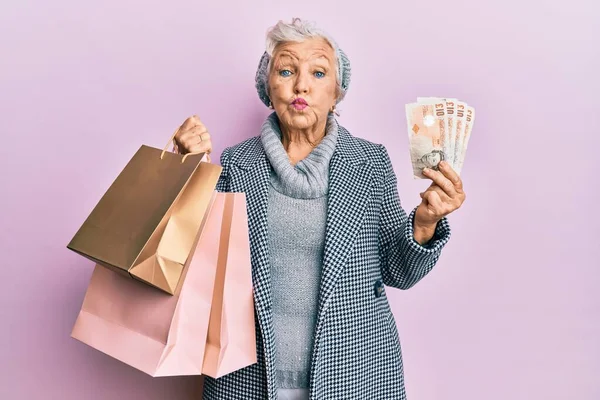 Senior Grey Haired Woman Holding Shopping Bags Pounds Banknotes Puffing — Stock Photo, Image