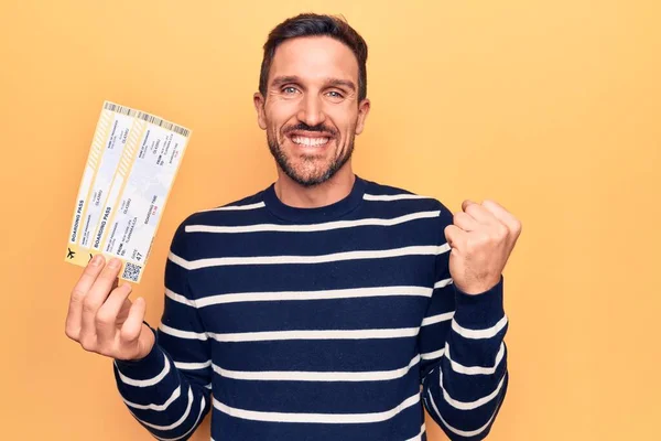 Young Handsome Tourist Man Vacation Holding Airline Boarding Pass Yellow —  Fotos de Stock