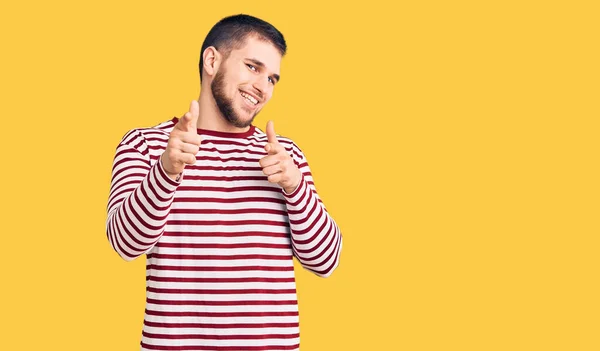 Young Handsome Man Wearing Striped Sweater Pointing Fingers Camera Happy — Stock Photo, Image